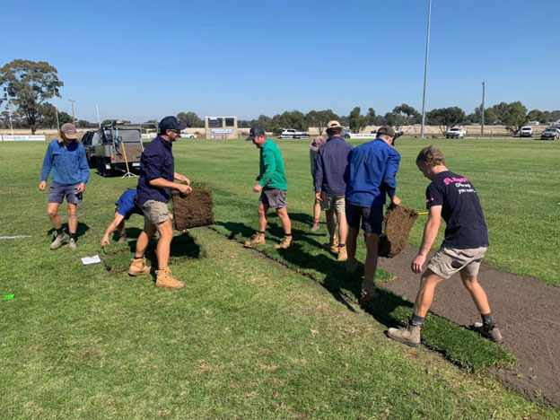 Coolabah Turf team is laying turf in the Bridgewater football netball club